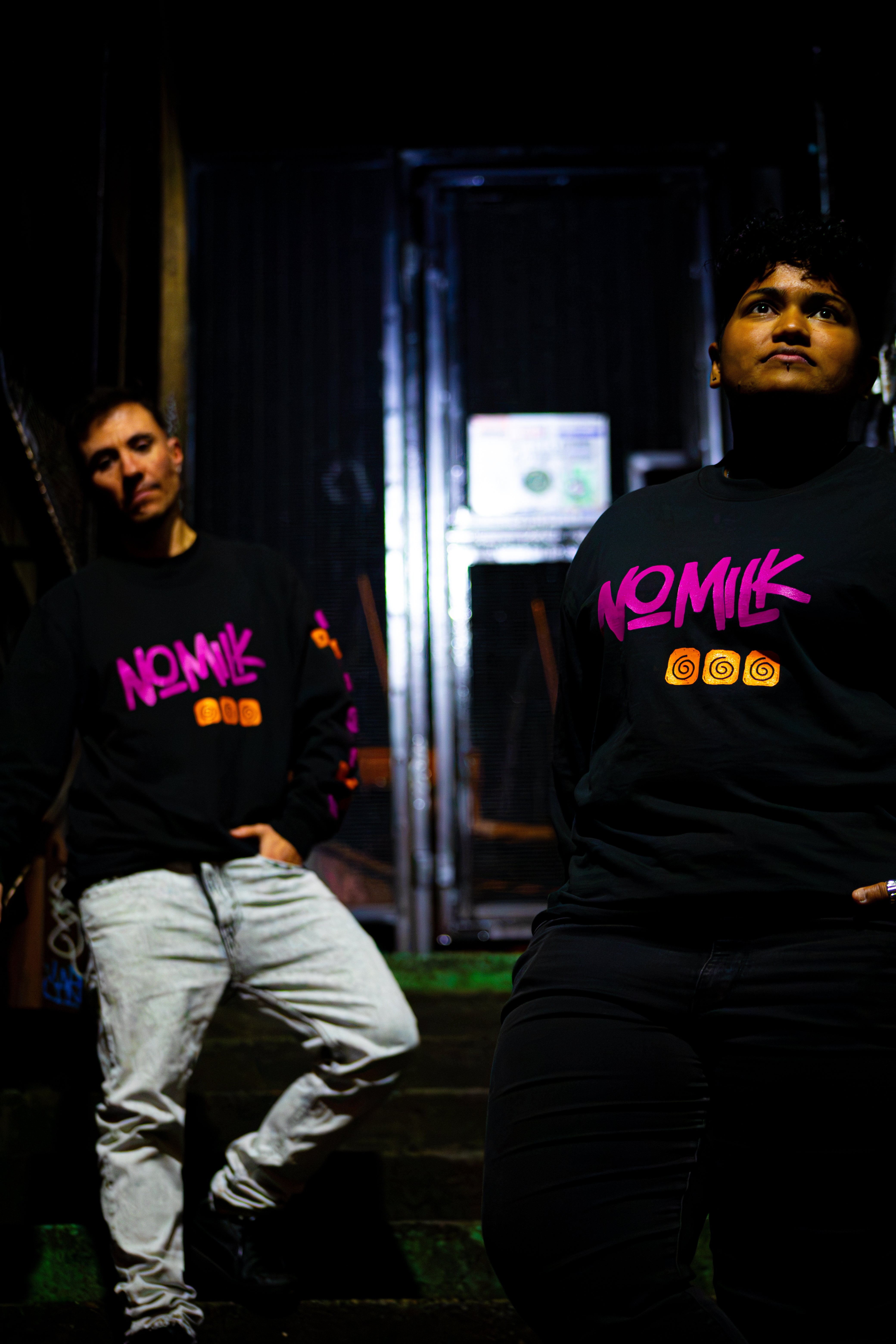 2 friends standing on urban staircase near the train tunnel, in Noughts Win long sleeve